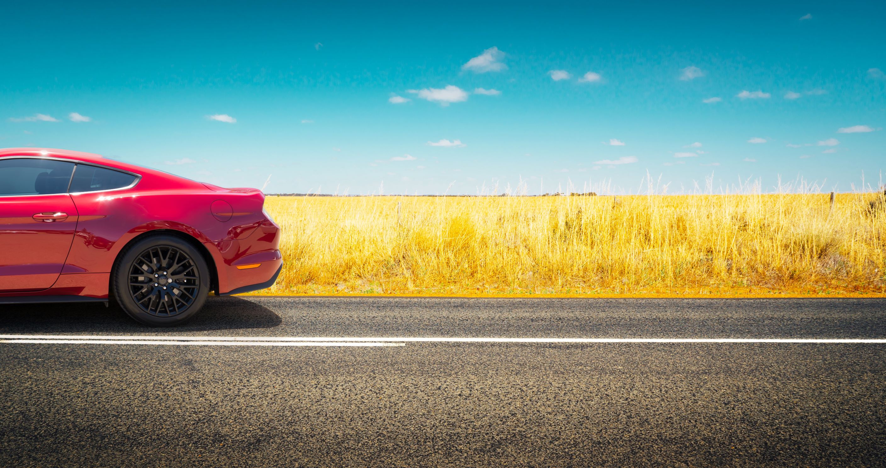 Car driving in wheat field click here for auto laon