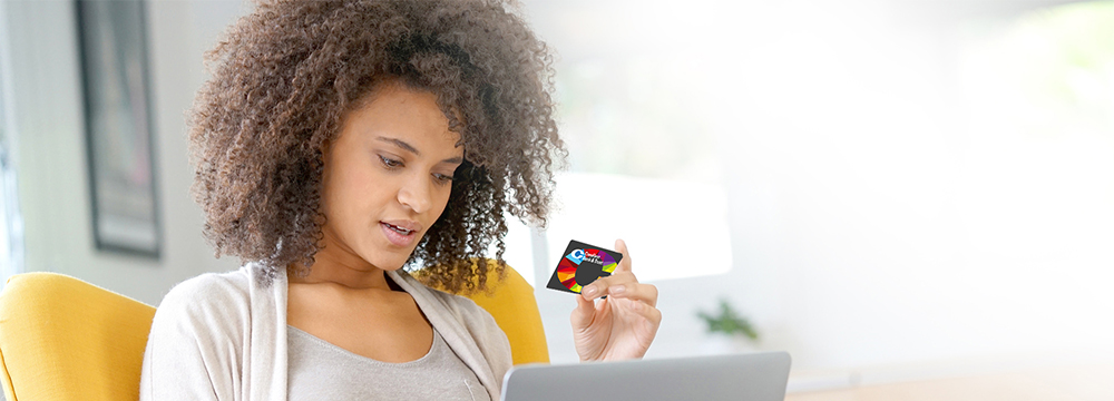 Girl holding credit card