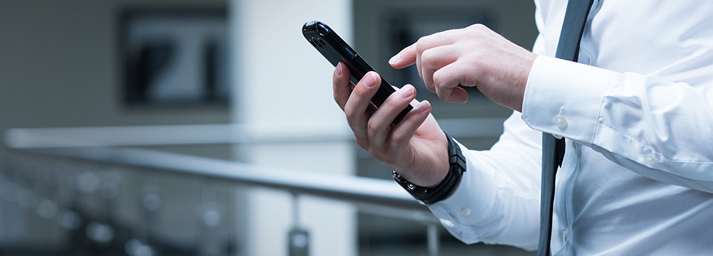 Businessman using mobile app