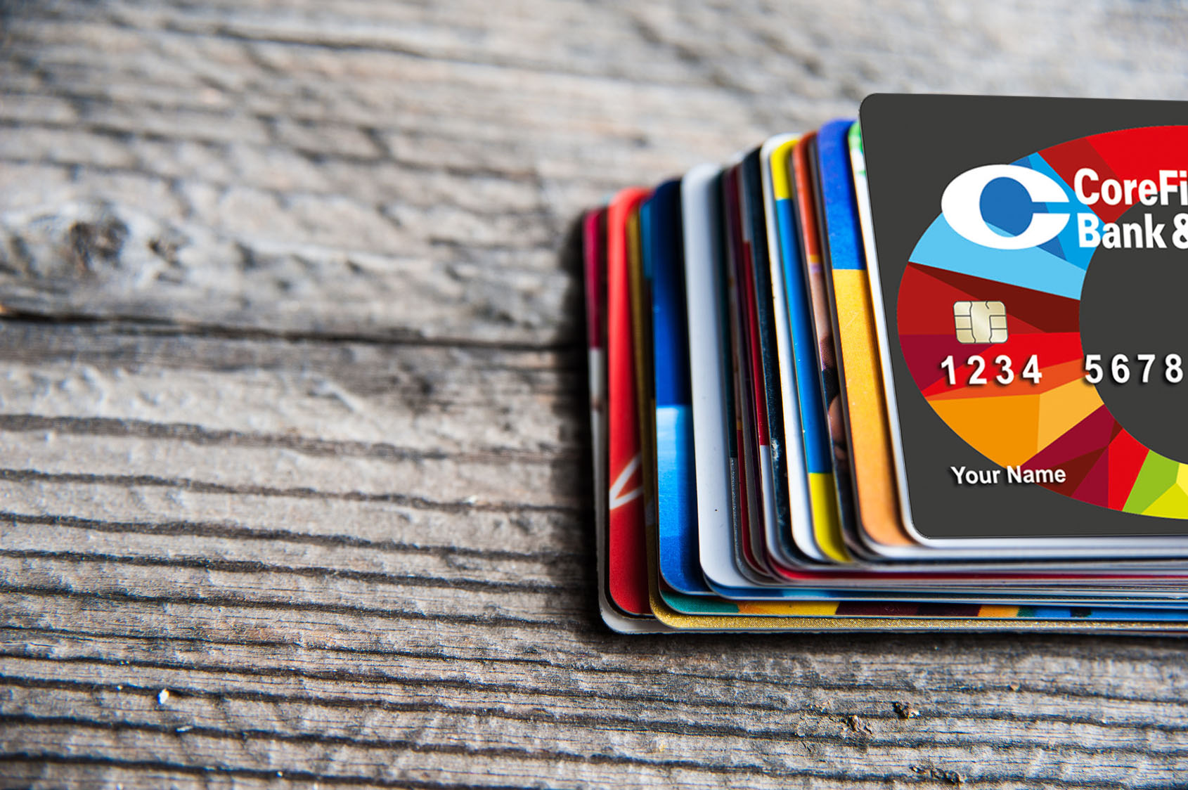 Stack of credit cards with a CoreFirst Core Card on top