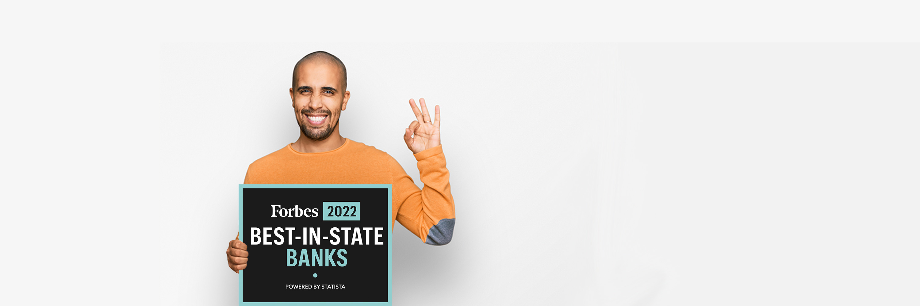 Man holding best in state sign