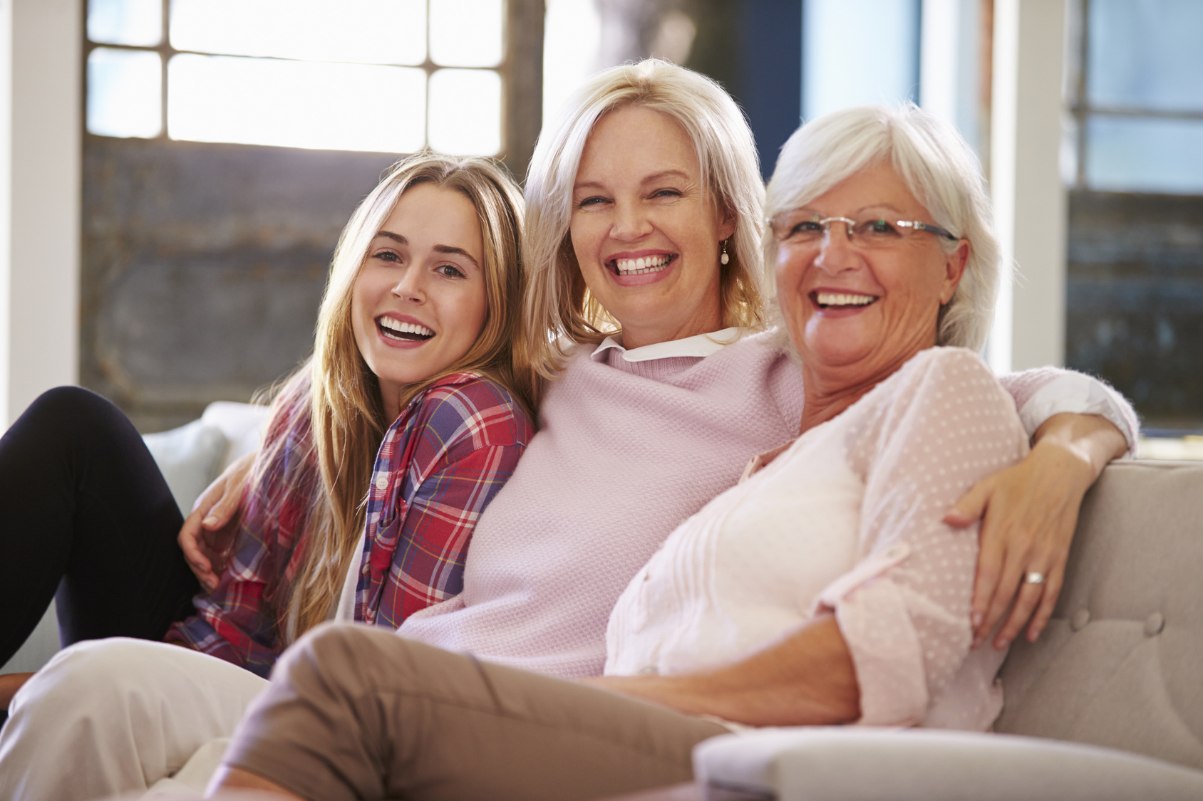 Three generations of women smiling